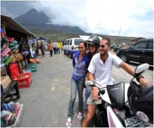 Indonesian City Bans Women from Straddling Male Drivers on Motorbikes Indonesian City Bans Women from Straddling Male Drivers on Motorbikes