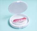 A Guide to Dentures: Types, Care, and Maintenance